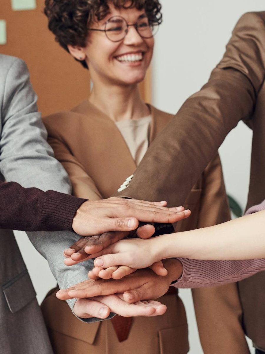 photo-of-people-holding-each-others-hands-3184424-scaled